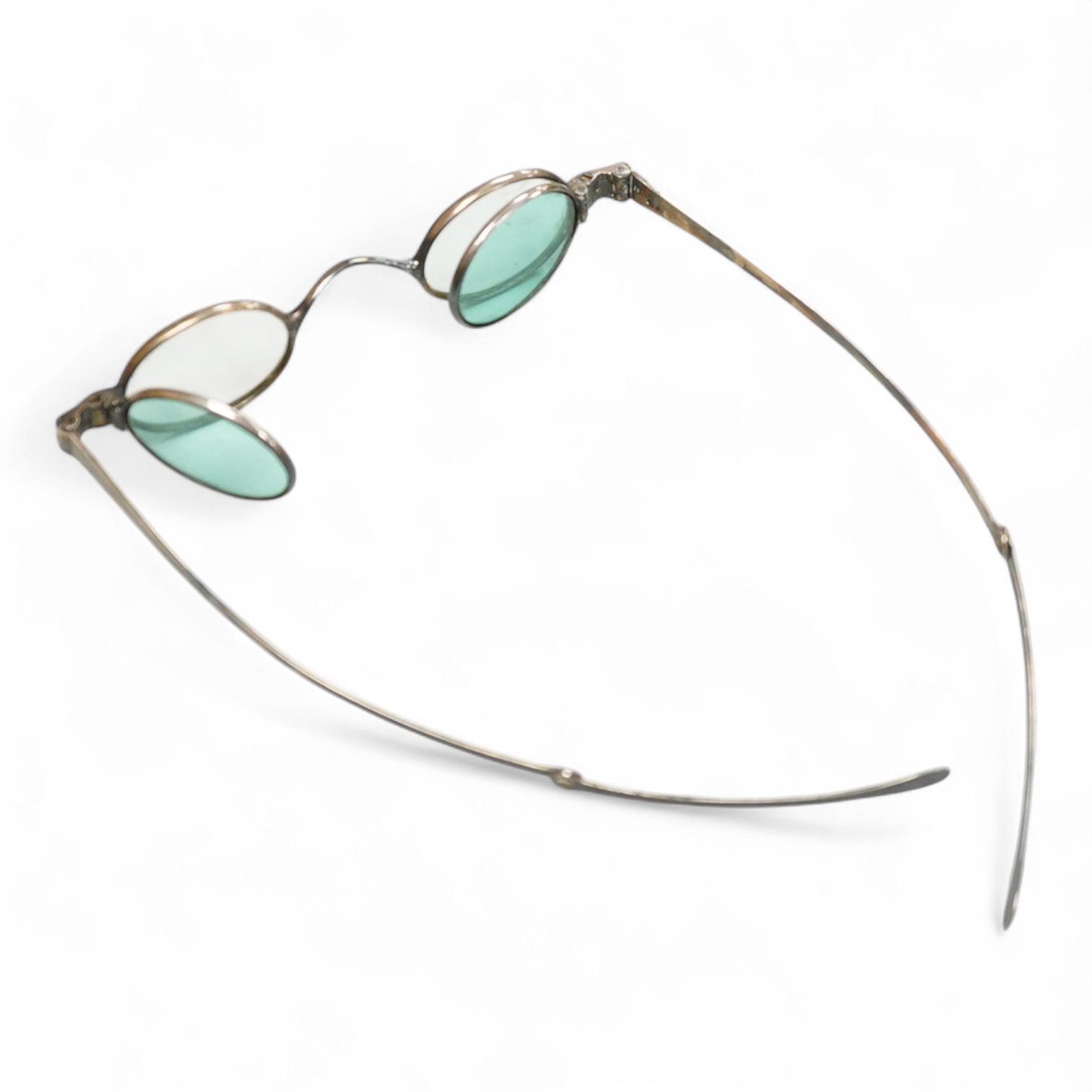 A pair of George IV silver turn pin hinged spectacles with tinted and clear double folding lenses, mm. H.I, London 1825, card case